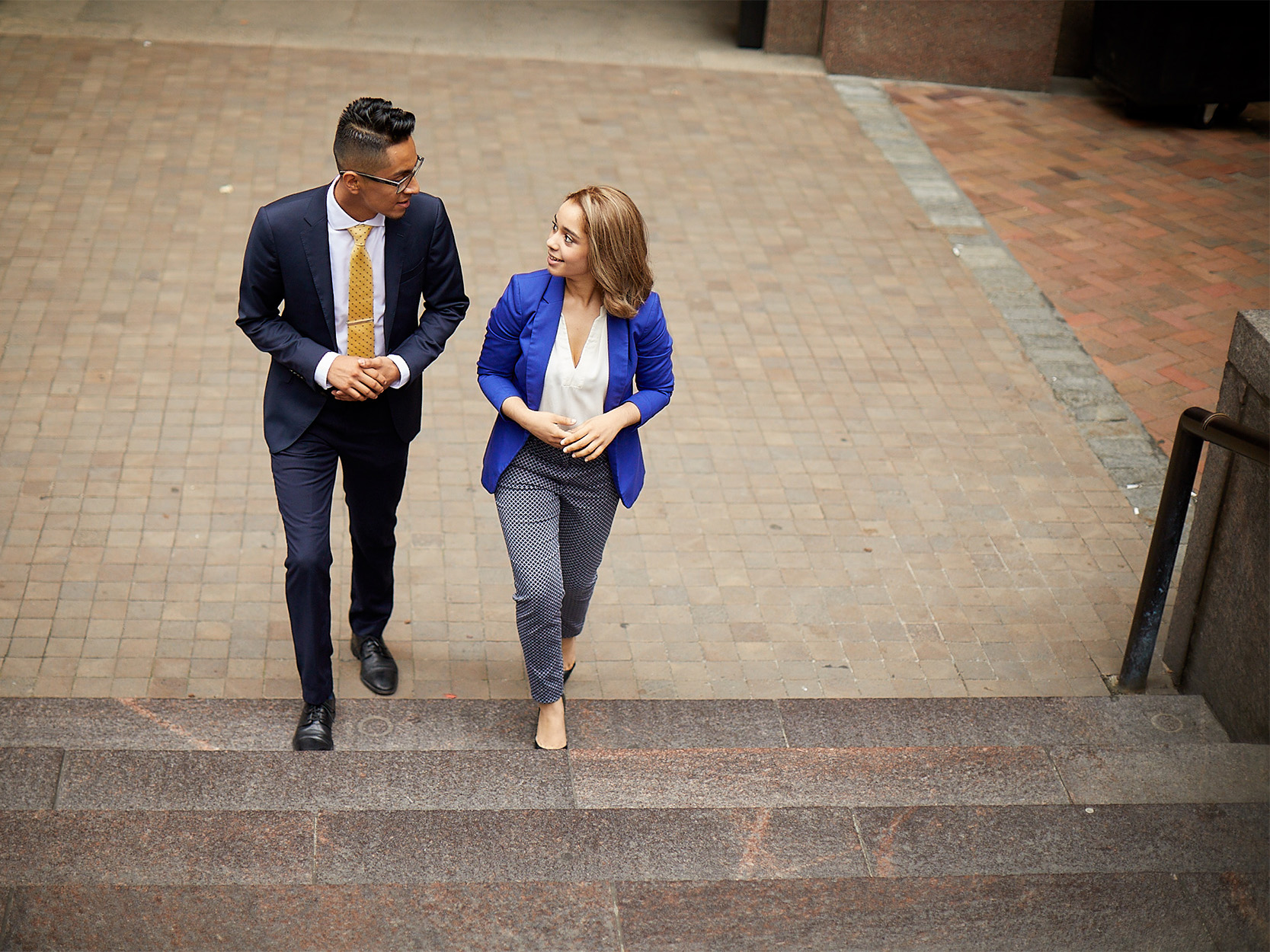two YUU students walking up steps